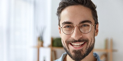 Man with attractive smile using direct bonding.
