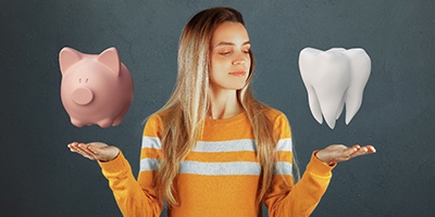 Picture of piggy bank and tooth hovering over a woman’s hands.