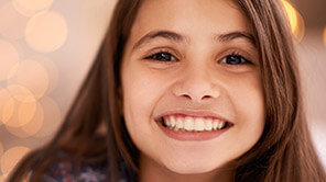 young girl with bashful smile