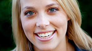 Blonde lady with big hearty smile