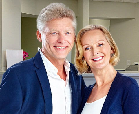 Elderly couple with matching clothes smiling